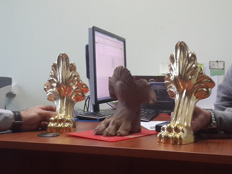 The new foot sculpture next to the old feet